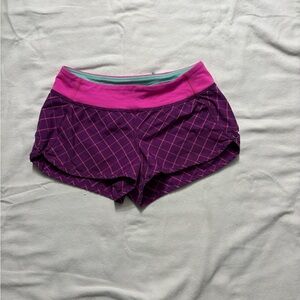 Ivivva by Lululemon pink and purple speedy shorts size girls 12 back pockets